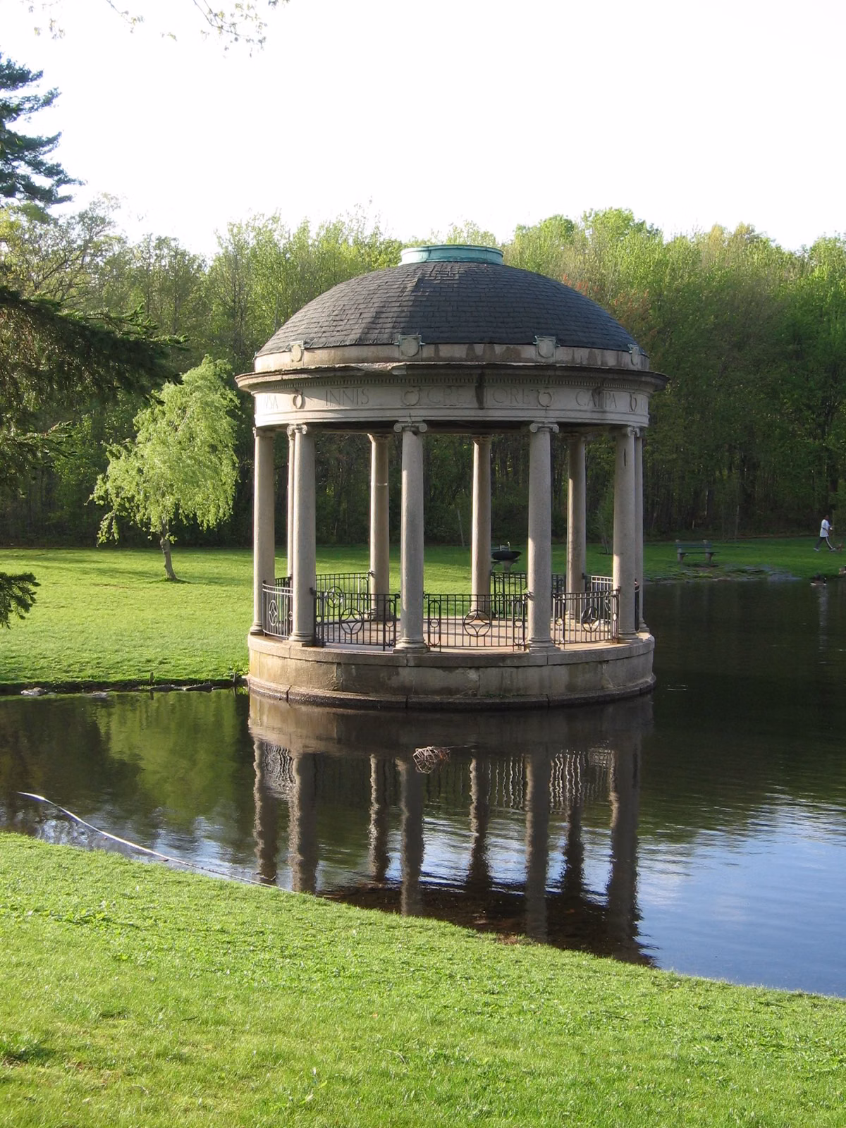 The domed stone bandstand by the pond in Slater Memorial Park